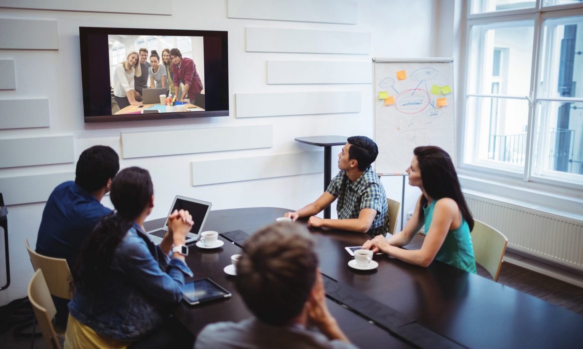 Business executives doing a video conference Business executives doing a video conference in the conference room